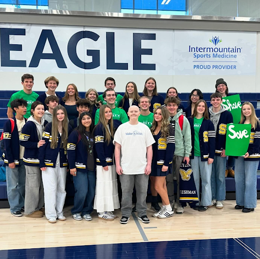 Rusty (middle) surrounded by Skyline High School SBOs, Elizabeth Holbrook (right of Rusty) 
Photo Credit : @RallyforRusty on Instagram