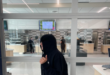 Student Charlie Bird in front of the cafeteria.
PHOTO CREDIT: Claire Gordts
